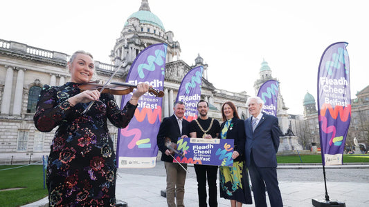 Traditional Irish musicians performing at Fleadh Cheoil na hÉireann during a city-wide festival in Belfast