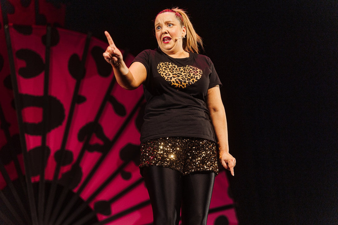 Caroline Curran performing Maggie’s Menopause comedy show on stage